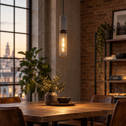 Urban concrete pendant light over an industrial-style dining table