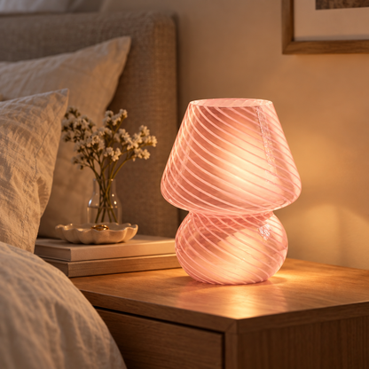 Murano-style glass mushroom lamp on a bedside table